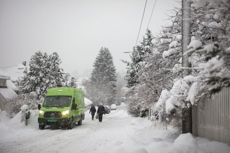 A Bring car stands on a snow-covered street