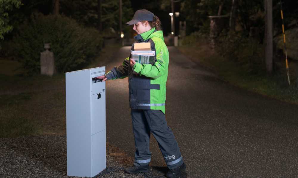 Bring employee puts mail in a mailbox